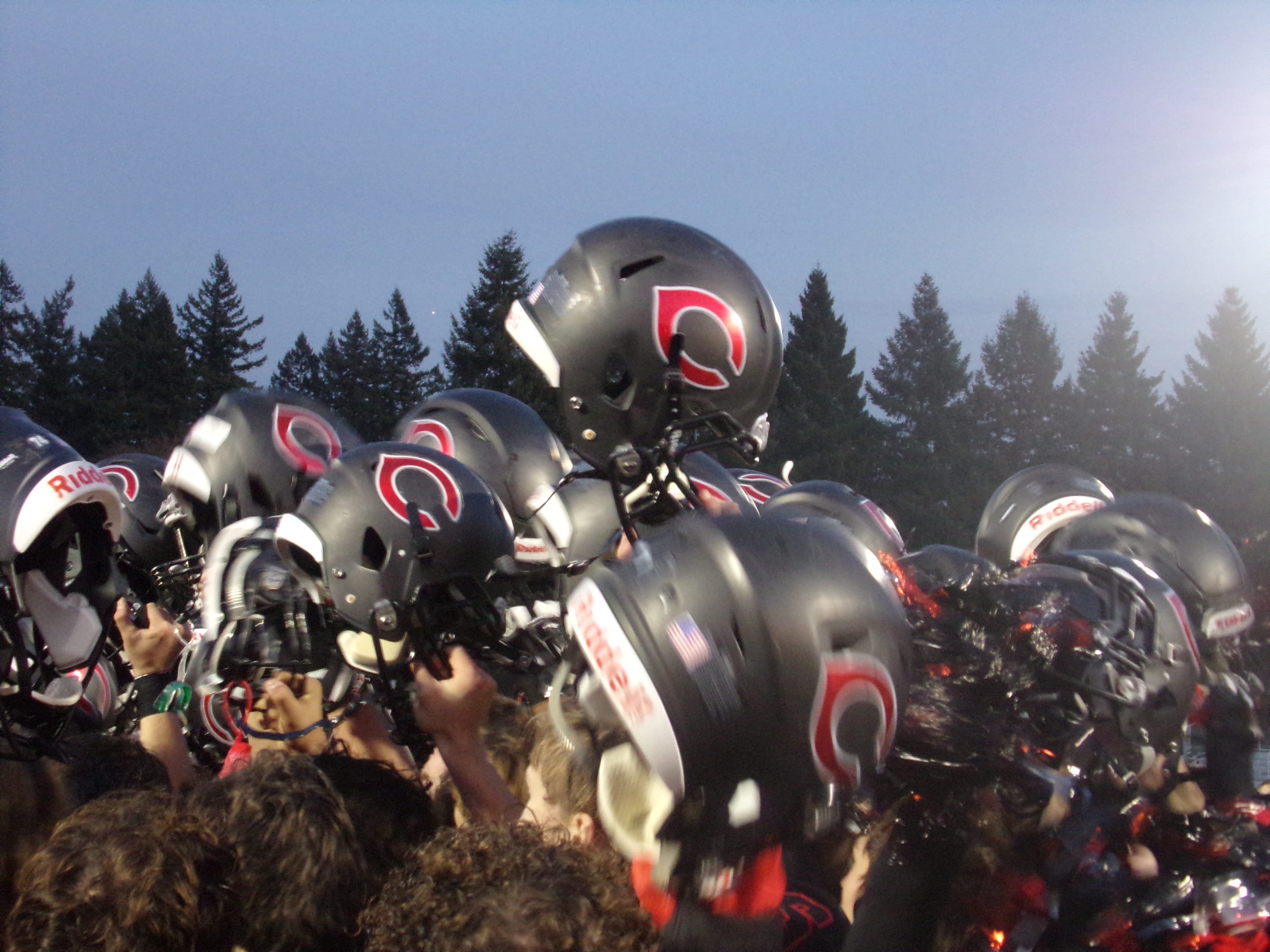 Camas players celebrate after their 56-27 win over Puyallup (Tim Martinez/The Columbian)