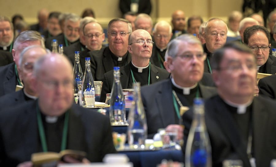 Bishops are seated during the opening moments of the United States Conference of Catholic Bishops Fall General Assembly at the Baltimore Marriott Waterfront Monday, Nov. 11, 2019.