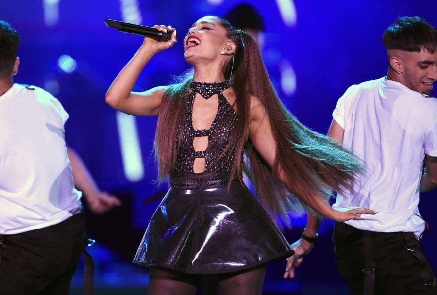 FILE - In this June 2, 2018 file photo, Ariana Grande performs at Wango Tango in Los Angeles. An AP reporter recently shared what she learned about being scammed trying to buy Ariana Grande concert tickets. Experts warn that digital wallet services like Apple Cash and Venmo are prime targets for scammers.
