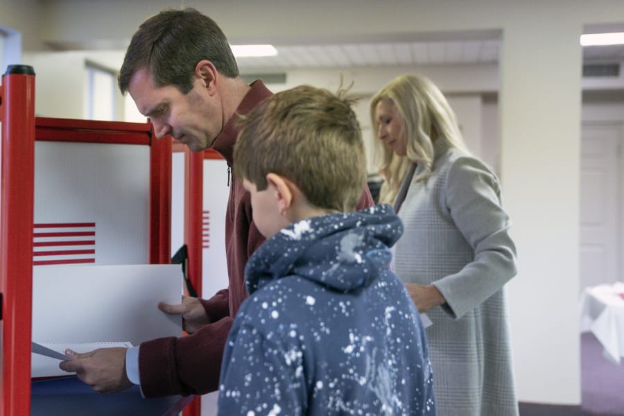 Kentucky Attorney General and democratic Gubernatorial candidate Andy Beshear studies his ballot at the Knights of Columbus polling location Tuesday, Nov. 5, 2019, in Louisville, Ky. Kentucky&#039;s voters are now deciding the political grudge match between Republican Gov. Matt Bevin and Beshear.