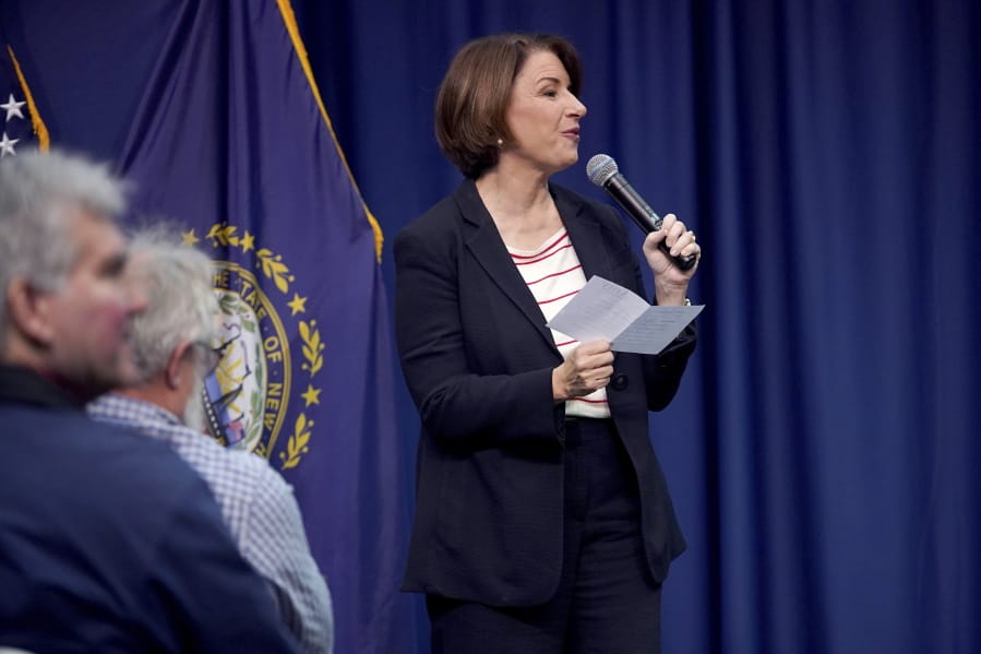 Democratic presidential candidate Sen. Amy Klobuchar, D-Minn., responds to a question she pulled from a bucket during a campaign stop, Friday, Nov. 22, 2019, in Henniker, N.H.