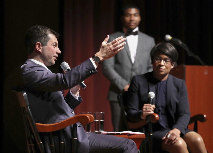 Presidential hopeful Pete Buttigieg, Mayor of South Bend, Ind., holds a conversation with Dr. Adrienne Jones, right, at Morehouse College on Monday, Nov. 18, 2019, in Atlanta.