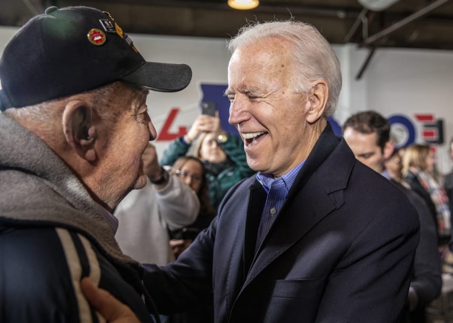 Democratic presidential candidate former Vice President Joe Biden talks with World War II veteran Art Greenquist of Galesburg, Ill., after an event, Saturday, Nov. 23, 2019, in Des Moines, Iowa.