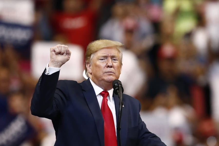 President Donald Trump gestures after speaking at a campaign rally Tuesday, Nov. 26, 2019, in Sunrise, Fla.