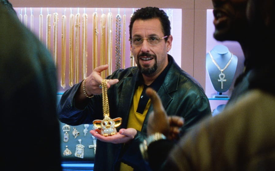 This image released by A24 shows Adam Sandler in a scene from &quot;Uncut Gems.&quot; The Safdie brothers&#039; Diamond District crime film &quot;Uncut Gems&quot; and Robert Eggers&#039; fever-dream period tale &quot;The Lighthouse&quot; lead the 35th annual Film Independent Spirit Awards with five nominations each. The Spirit Awards will be held Feb. 8, the day before the Academy Awards.