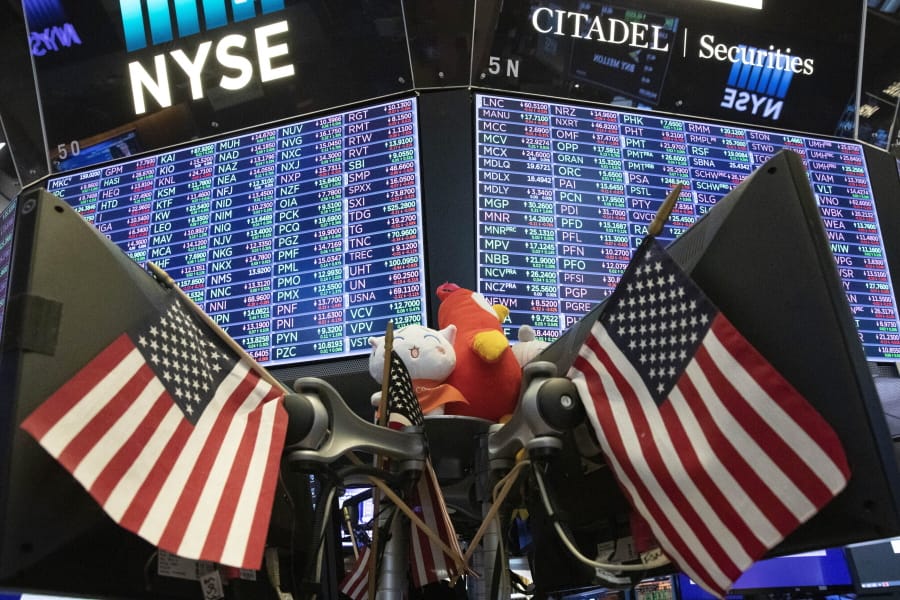 FILE - In this Sept. 18, 2019, file photo, stock prices are displayed at the New York Stock Exchange. U.S. stocks pushed upward in early trading Friday, Nov. 22, 2019, following a global tide higher, as a week clouded by uncertainty about progress in U.S.-China trade talks comes to a close.