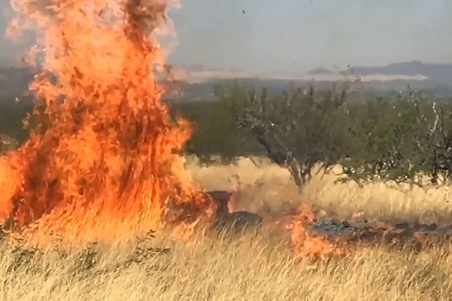 In this frame grab from a April 23, 2017, video provided by the U.S. Forest Service, is a gender reveal event in the Santa Rita Mountain&#039;s foothills, more than 40 miles southeast of Tucson, Ariz. The explosion from the reveal ignited the 47,000-acre Sawmill Fire. Gender reveal parties with a blast of color, pink or blue, that were once considered private gatherings have become social media spectacles, sometimes with dangerous consequences. (U.S.