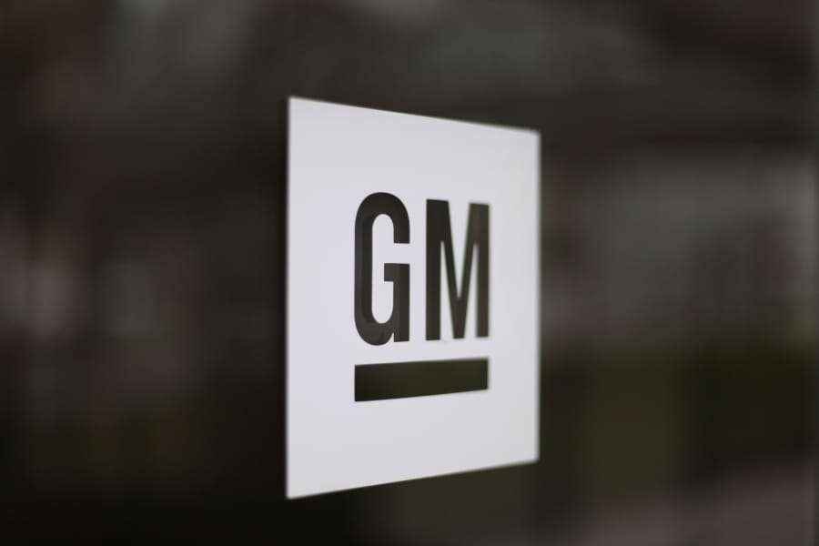FILE - This May 16, 2014, file photo, shows the General Motors logo at the company&#039;s world headquarters in Detroit. General Motors is suing Fiat Chrysler, alleging that its crosstown rival got an unfair business advantage by bribing officials of the United Auto Workers union. The lawsuit, filed Wednesday, Nov. 20, 2019,  in U.S. District Court in Detroit, alleges that FCA was involved in racketeering by paying millions in bribes to get concessions and gain advantages in three labor agreements with the union.