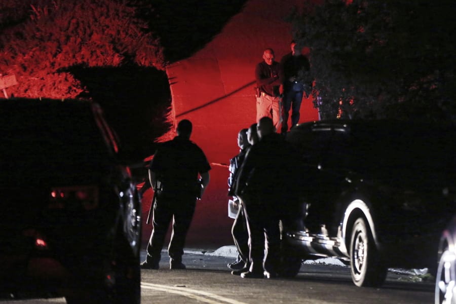 Contra Costa County Sheriff deputies investigate a multiple shooting in Orinda, Calif., on Thursday, Oct. 31, 2019. Four people were killed and four others wounded in a Halloween night party shooting at a large rental home in a wealthy San Francisco Bay Area community, police said Friday.  The shooting in the city of about 20,000 just east of Berkeley, happened at a party attended by 100 people said police chief David Cook.