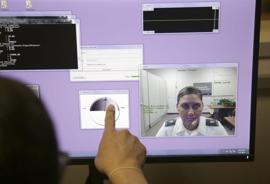 A computer monitors some of Cadet Cheyenne Quilter&#039;s reactions as she works May 2 with a virtual reality character named &quot;Ellie&quot; at the U.S. Military Academy at West Point, N.Y. Artificial intelligence is spreading into health care.