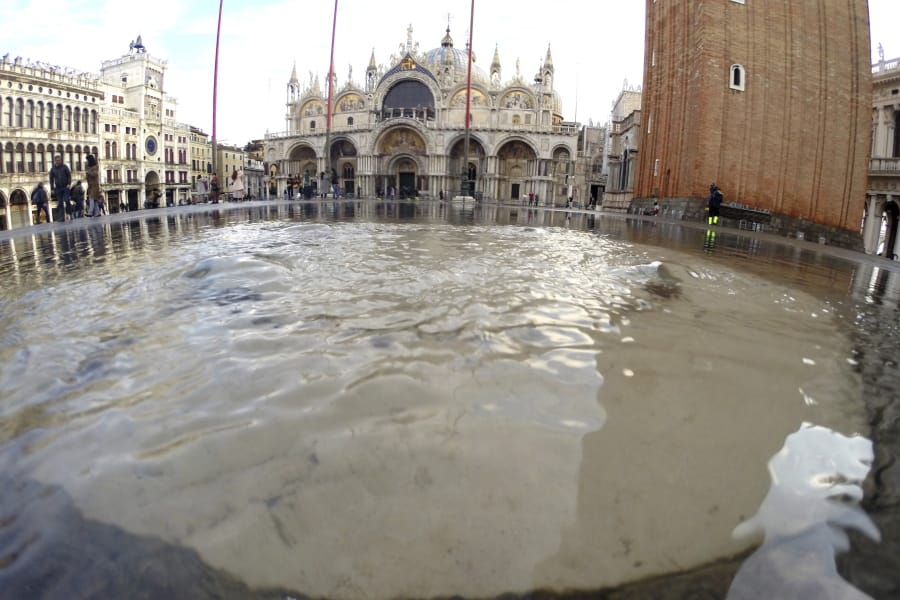 Water starts rising again in St. Mark square in Venice, Italy, Saturday, Nov. 16, 2019. High tidal waters returned to Venice on Saturday, four days after the city experienced its worst flooding in 50 years.