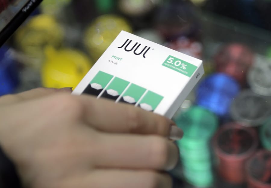 The e-cigarette maker Juul Labs said Thursday, Nov.7, 2019, that it will halt sales of its best-selling mint-flavored vaping pods.
