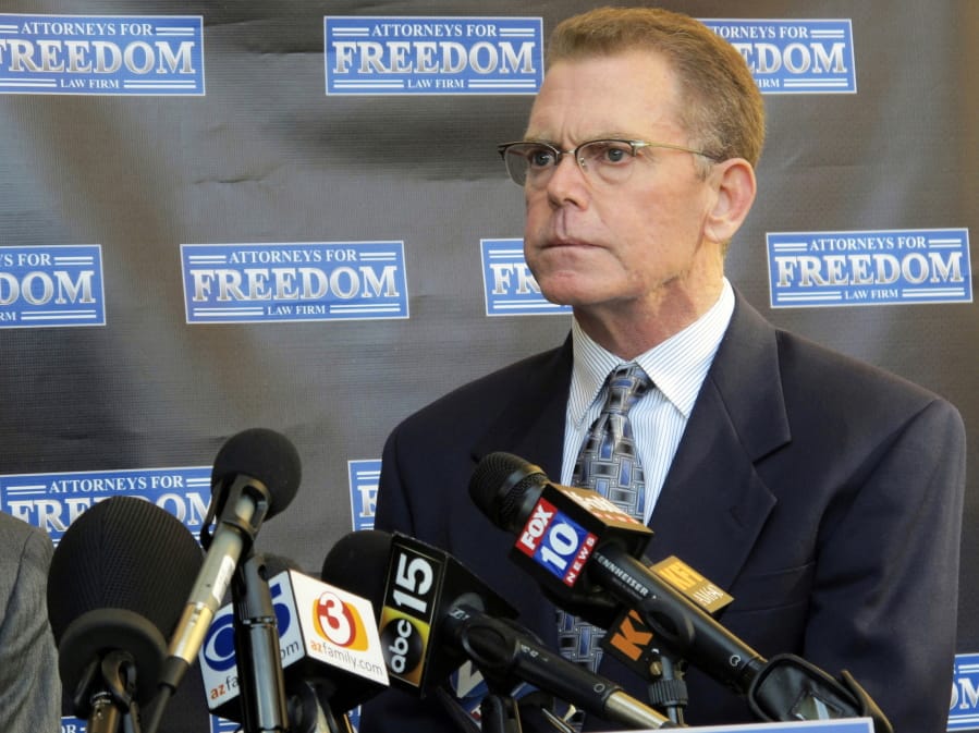 FILE - In this Feb. 2, 2018, file photo, Douglas Haig takes questions from reporters at a news conference in Chandler, Ariz. Haig plans to plead guilty in a federal case in Nevada alleging he illegally manufactured ammunition sold to the gunman who carried out the Las Vegas Strip massacre in October 2017. A court notice posted Tuesday, Nov. 12, 2019, set a change-of-plea hearing next week for Haig in Las Vegas, ahead of trial scheduled next month.