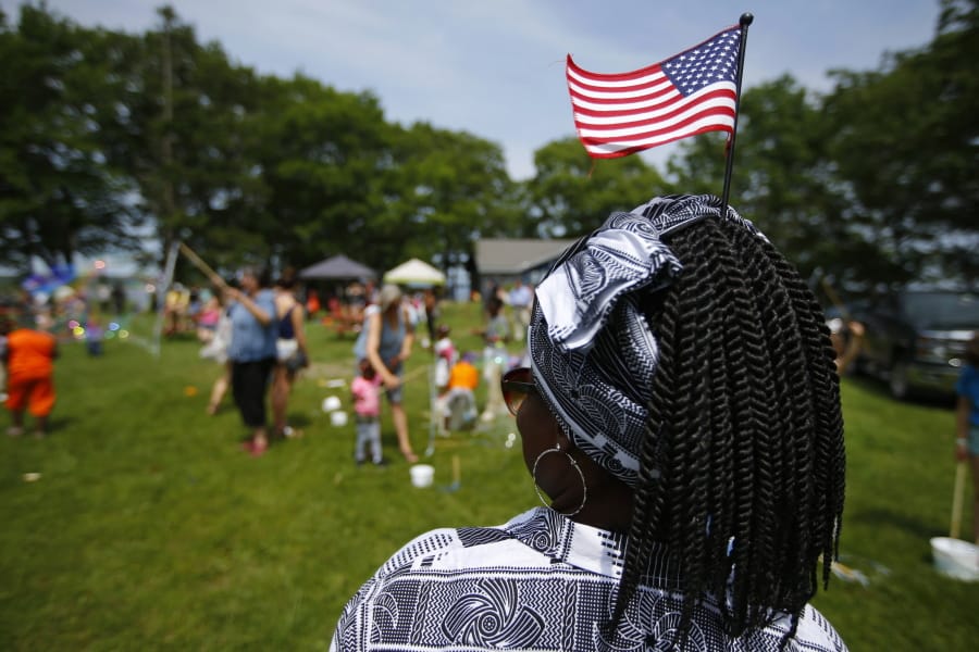 FILE - In this July 4, 2019, file photo, Malu Klo, an asylum seeker from the Congo, attends a picnic for refugees at Fort Williams Park in Cape Elizabeth, Maine. Three agencies in charge of resettling refugees in the U.S. are suing the Trump administration over the president&#039;s executive order allowing states and cities to block refugees from being settled in their areas. The lawsuit was filed Thursday, Nov. 21, 2019, by HIAS, Church World Service, and Lutheran Immigration and Refugee Services in U.S. District Court in Baltimore. (AP Photo/Robert F.