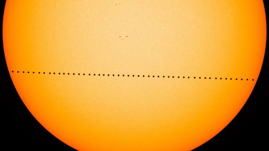 In this composite image, the planet Mercury is visible as it passes directly between the sun and Earth on May 9, 2016, in a transit which lasted 7 1/2  hours. On Monday morning, Mercury will make another transit.