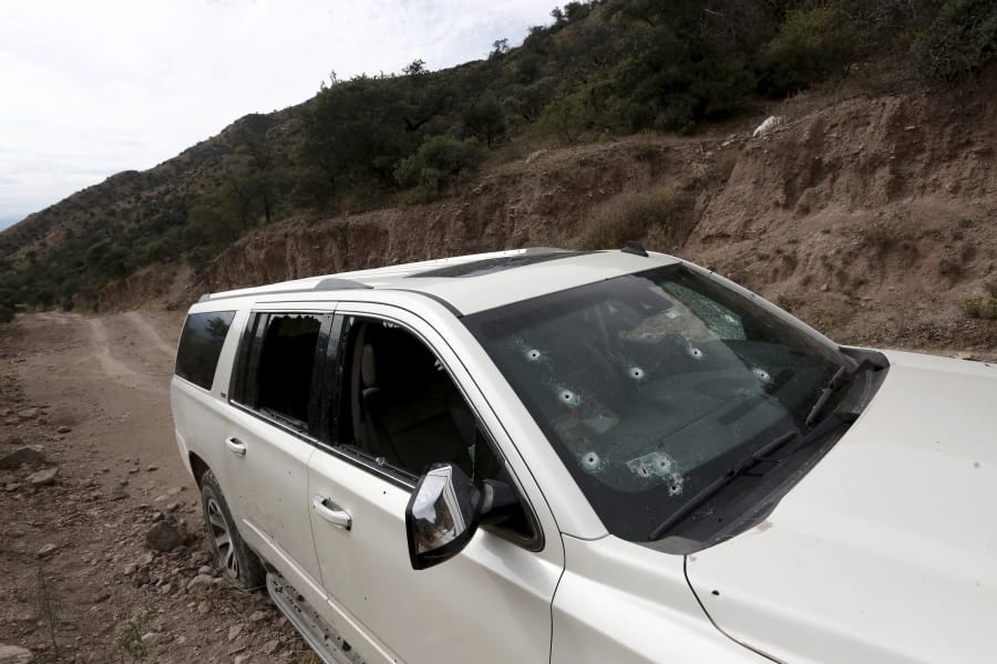 A bullet-riddled vehicle that members of LeBaron family were traveling in sits parked on a dirt road near Bavispe, at the Sonora-Chihuahua border, Mexico, Wednesday, Nov 6, 2019. Three women and six of their children, related to the extended LeBaron family, were gunned down in an attack while traveling along Mexico&#039;s Chihuahua and Sonora state border on Monday.
