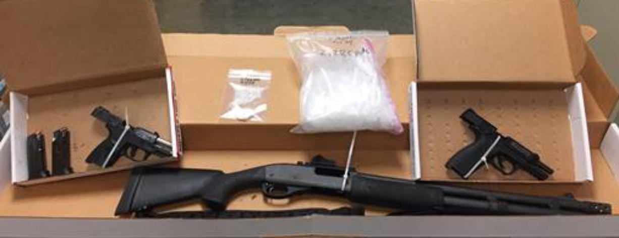 Vancouver police arrested a wanted man Sunday and seized two pistols, a shotgun, tactical equipment, holsters, ammunition, 2.2 pounds of methamphetamine, 0.25 ounces of cocaine, and drug paraphernalia and materials used for distribution.