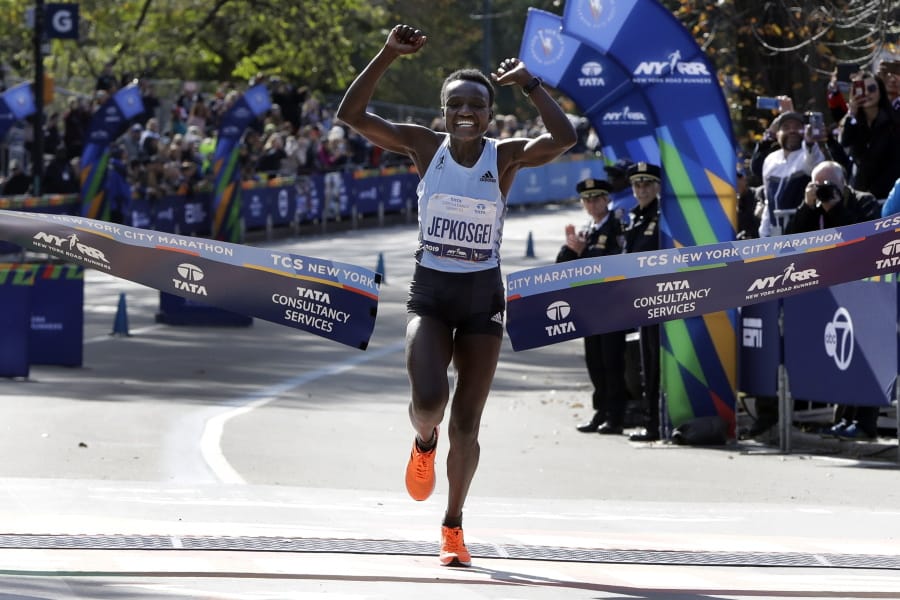 Joyciline Jepkosgei, of Kenya, crosses the finish line to win the Pro Women&#039;s Division of the New York City Marathon, in New York&#039;s Central Park, Sunday, Nov. 3, 2019.