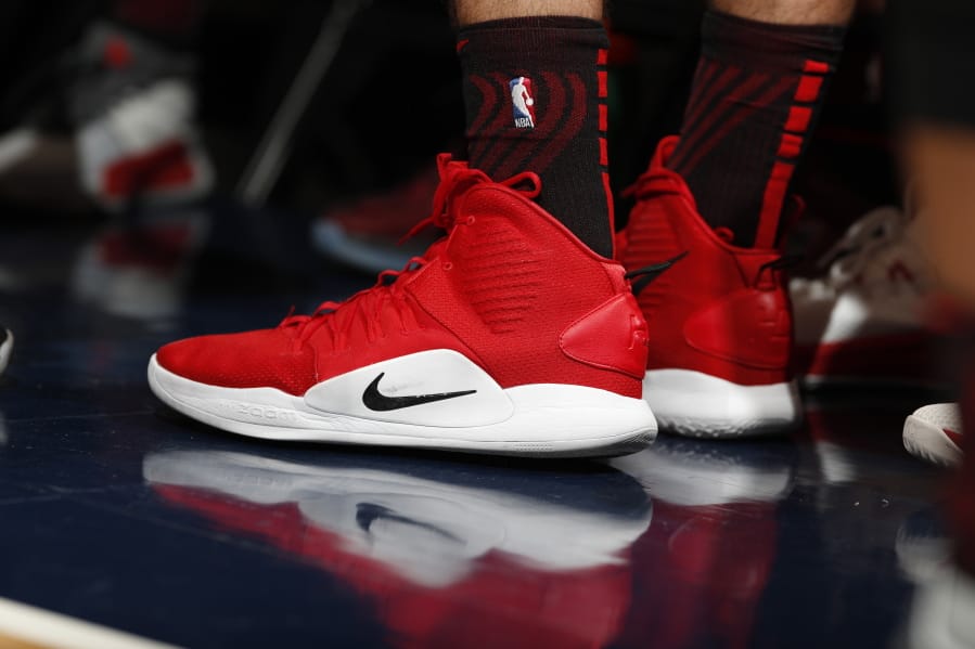 FILE - In this Jan. 13, 2019, file photo Portland Trail Blazers forward Zach Collins (33) wears a pair of Nike Hyperdunks in the first half of an NBA basketball game in Denver. Nike is ending a sales partnership with Amazon less than a month after the athletic gear company named e-commerce veteran John Donahoe as its new CEO.