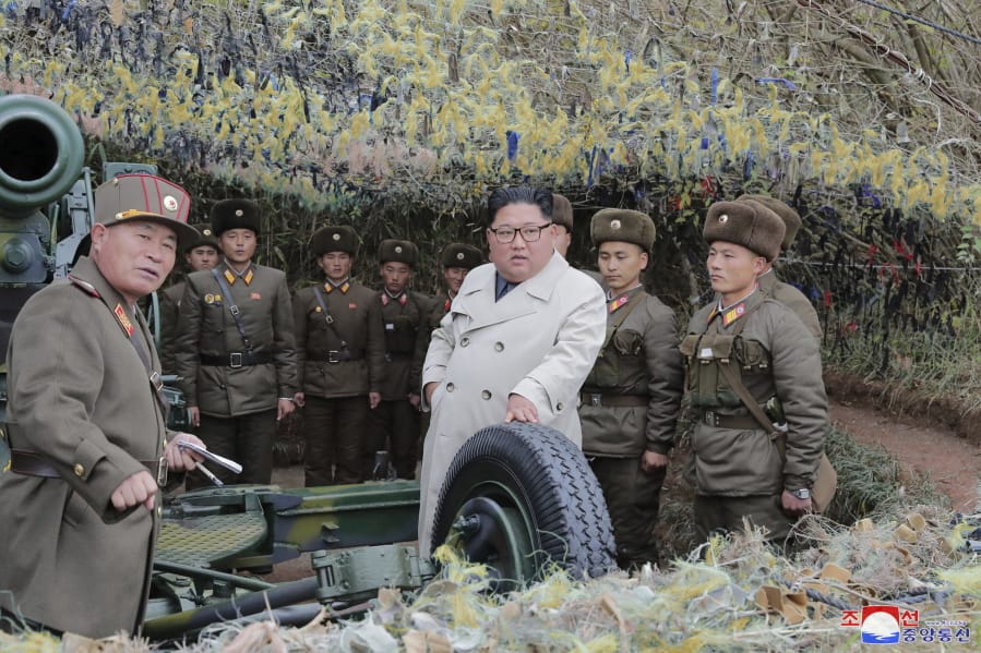 In this undated photo provided on Monday, Nov. 25, 2019, by the North Korean government, North Korean leader Kim Jong Un, center, inspects a military unit on Changrin Islet in North Korea. Independent journalists were not given access to cover the event depicted in this image distributed by the North Korean government. The content of this image is as provided and cannot be independently verified. Korean language watermark on image as provided by source reads: &quot;KCNA&quot; which is the abbreviation for Korean Central News Agency.