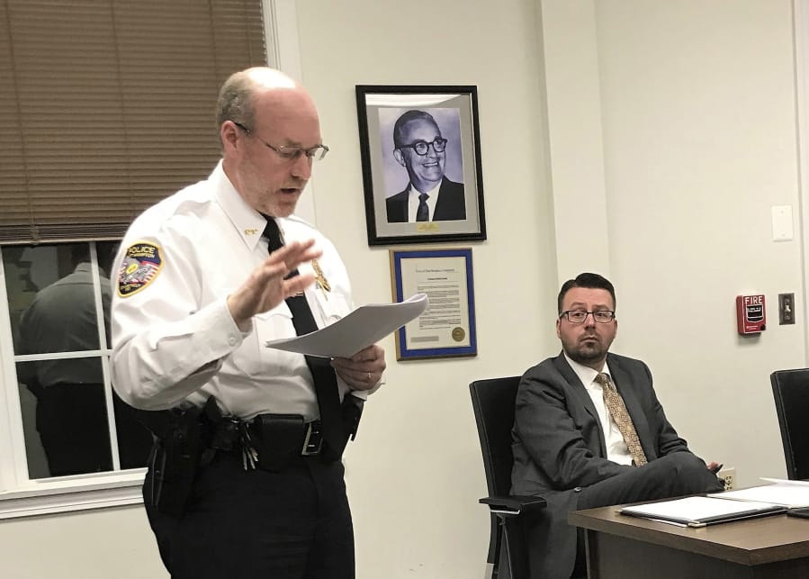 FILE - In this Nov. 14, 2018 file photo, East Hampton, Conn., Police Chief Dennis Woessner addresses the Town Council in East Hampton. East Hampton officer Kevin P. Wilcox, has retired from the force after Committee for Civil Rights Under Law raised concerns about his membership with the Proud Boys, a far-right group known for engaging in violent clashes at political rallies. In September, Woessner told the civil rights organization that Wilcox&#039;s Proud Boys membership didn&#039;t violate department policies.