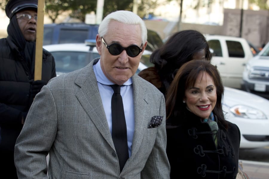 Roger Stone accompanied by his wife Nydia Stone, right, arrives at federal court in Washington, Thursday, Nov. 14, 2019.