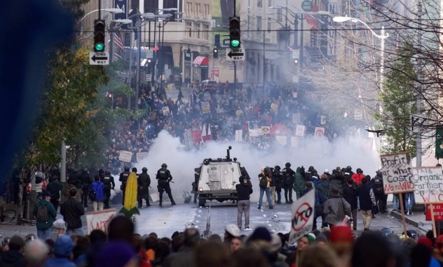 Seattle police use tear gas to push back World Trade Organization protesters in downtown Seattle on Nov. 30, 1999.