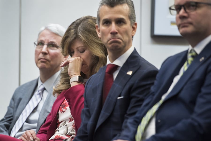 Susan Payne, founder and executive director of Safe2Tell wipes tears, as Peter Langman, left, Max Schachter, who lost his son Alex during the Parkland school mass shooting, center, and Ryan Petty, right, who lost his daughter Alaina during the Parkland school mass shooting, appear at the the release of the Secret Service National Threat Assessment Center&#039;s Protecting America&#039;s Schools report, in Washington, Thursday, Nov. 7, 2019. The report examines 41-targeted attacks that occurred in schools between 2008 and 2017.