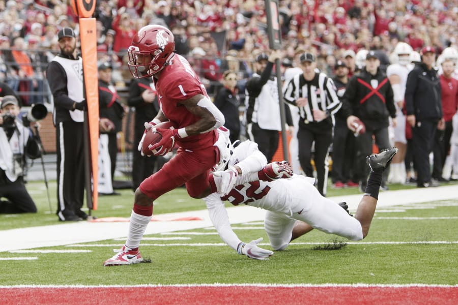 Washington State wide receiver Davontavean Martin, left, runs for a touchdown while pressured by Stanford cornerback Obi Eboh during the first half of an NCAA college football game in Pullman, Wash., Saturday, Nov. 16, 2019.