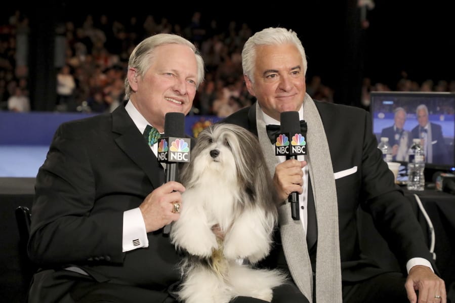 David Frei, left, and host John O&#039;Hurley pose with a Havanese dog at The National Dog Show in Philadelphia.