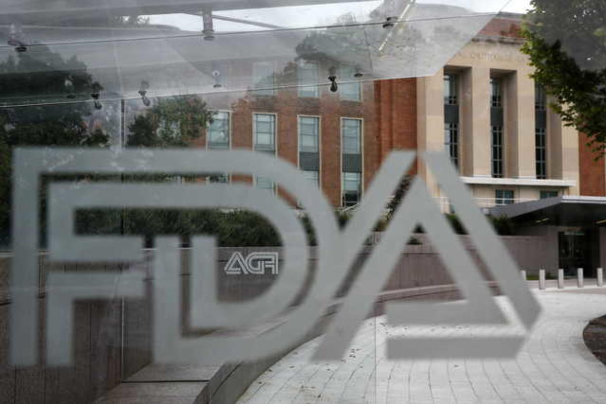 This Aug. 2, 2018, file photo shows the U.S. Food and Drug Administration building behind FDA logos at a bus stop on the agency’s campus in Silver Spring, Md. Teen vapers prefer Juul and mint is the #1 flavor among many of them, suggesting a shift after the company’s fruit and dessert flavors were removed from retail stores, new U.S. research suggests. The results are in a pair of studies published Tuesday, Nov. 5, 2019, including a report from the Food and Drug Administration and federal Centers for Disease Control and Prevention indicating that the U.S. teen vaping epidemic shows no signs of slowing down.