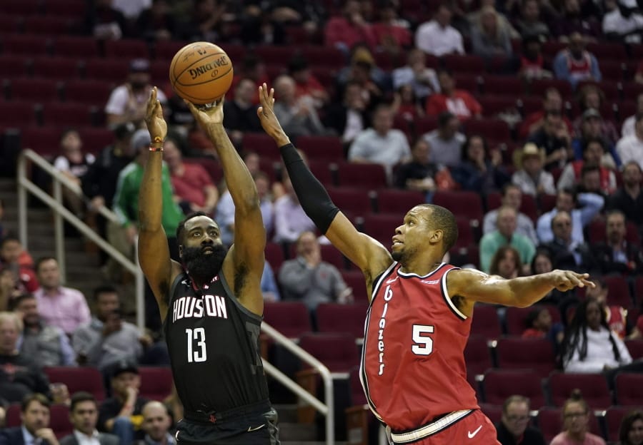 Houston Rockets&#039; James Harden (13) shoots as Portland Trail Blazers&#039; Rodney Hood (5) defends during the first half of an NBA basketball game Monday, Nov. 18, 2019, in Houston. (AP Photo/David J.