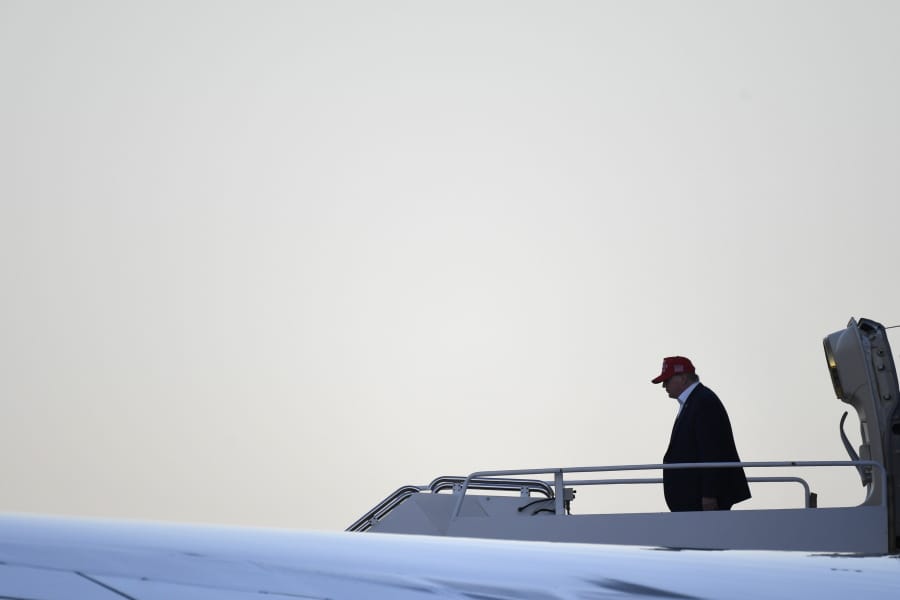 President Donald Trump walks down the steps of Air Force One at Palm Beach International Airport in West Palm Beach, Fla., Friday, Nov. 29, 2019. Trump is returning from a surprise trip to Afghanistan with troops for Thanksgiving.