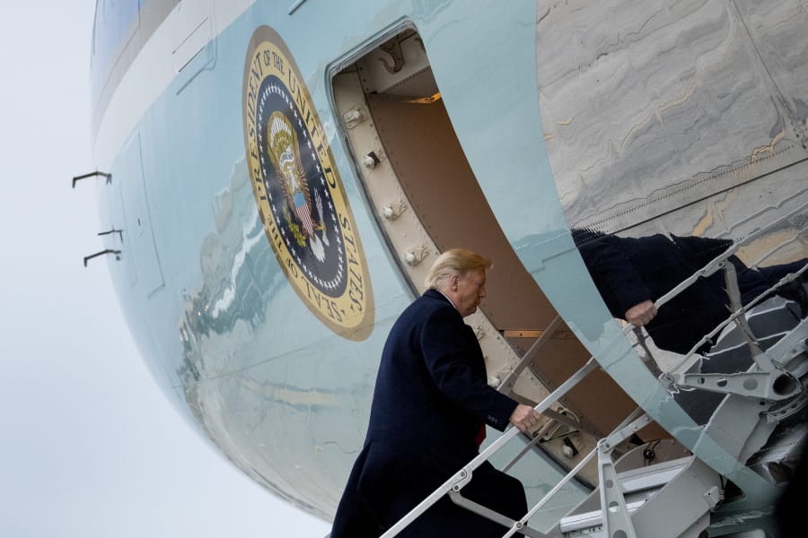 President Donald Trump boards Air Force One at John F. Kennedy International Airport in New York, Tuesday, Nov. 12, 2019, to travel to Washington.