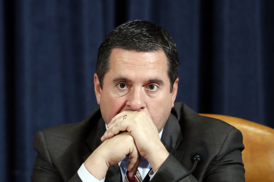 Ranking member Rep. Devin Nunes of Calif., listens as Ambassador Kurt Volker, former special envoy to Ukraine, and Tim Morrison, a former official at the National Security Council, testify before the House Intelligence Committee on Capitol Hill in Washington, Tuesday, Nov. 19, 2019, during a public impeachment hearing of President Donald Trump&#039;s efforts to tie U.S. aid for Ukraine to investigations of his political opponents.