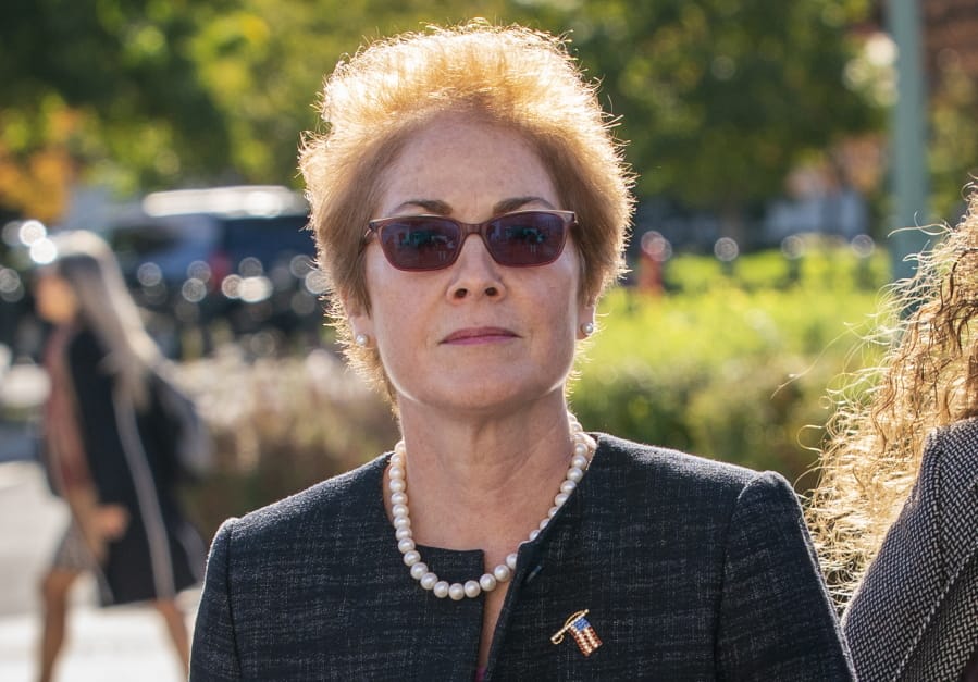 FILE - In this Oct. 11, 2019, file photo, former U.S. ambassador to Ukraine Marie Yovanovitch, arrives on Capitol Hill in Washington. The House impeachment panels are starting to release transcripts from their investigation. And in one of them, Yovanovitch says that Ukrainian officials warned her in advance that Rudy Giuliani and his allies were planning to &quot;do things, including to me.&quot; (AP Photo/J.