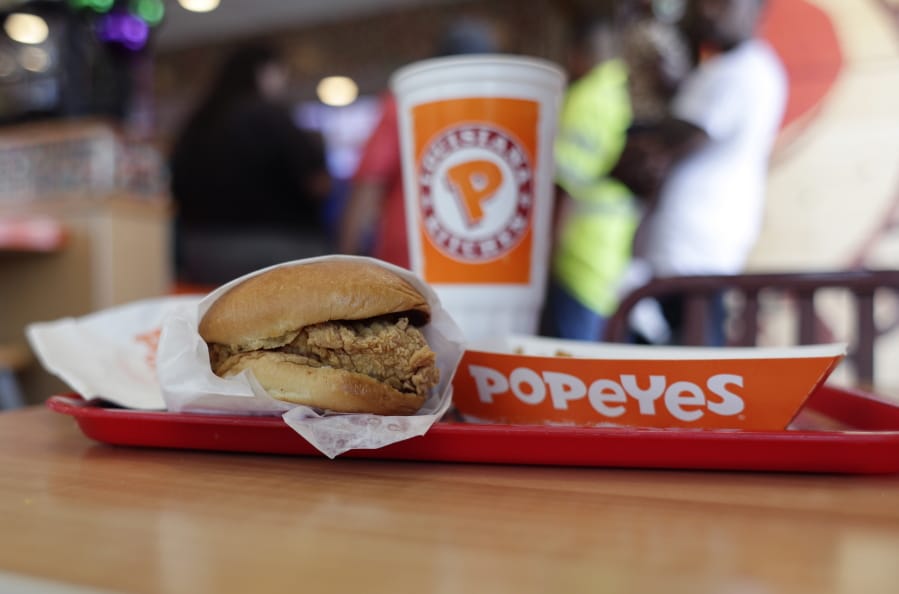 In this Aug. 22, 2019, photo, a chicken sandwich is seen at a Popeyes as guests wait in line, in Kyle, Texas. Police in Maryland say a man fatally stabbed another customer outside a Popeyes restaurant in a fight over the recently rereleased chicken sandwich. Police in Maryland say a man fatally stabbed another customer at a Popeyes restaurant in a fight over the recently rereleased chicken sandwich. A Prince George&#039;s County police spokeswoman told news outlets the two men were waiting in line at an Oxon Hill Popeye&#039;s Monday night, Nov. 4, 2019, when one of the men accused the other of cutting in front of him in a line specifically for ordering sandwiches. Police say the fight spilled outside where a 28-year-old was fatally stabbed.