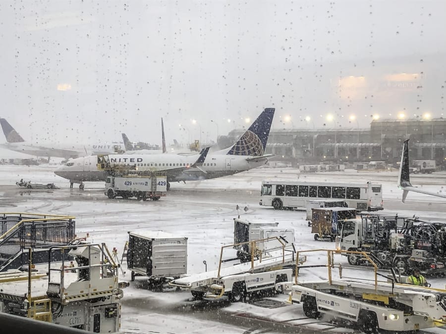 Snow falls on the United Terminal at O&#039;Hare Airport in Chicago Monday morning, Nov. 11, 2019.
