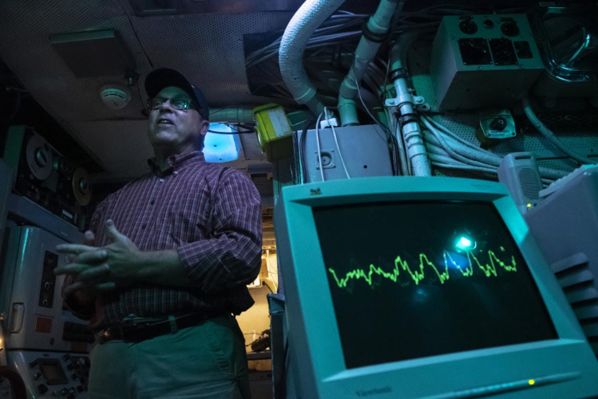 Mark Manzer, who served in the sonar room on the USS Sam Houston, talks about his service while leading a tour of the USS Blueback at the Oregon Museum of Science and Industry.