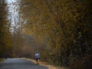 Scott Goodrich, an accountant for the Port of Vancouver, runs along Laframbois Road during his lunch break in Vancouver. Goodrich generally runs about four miles during his lunch break. It&#039;s part of his training regimen, which has lead to a successful run as an Ironman competitor.