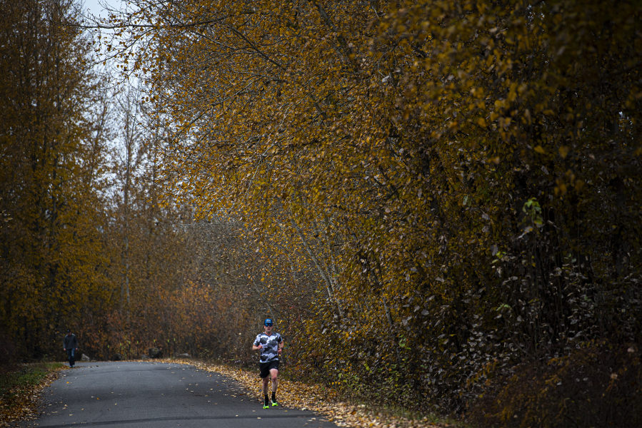 Scott Goodrich, an accountant for the Port of Vancouver, runs along Laframbois Road during his lunch break in Vancouver. Goodrich generally runs about four miles during his lunch break. It&#039;s part of his training regimen, which has lead to a successful run as an Ironman competitor.