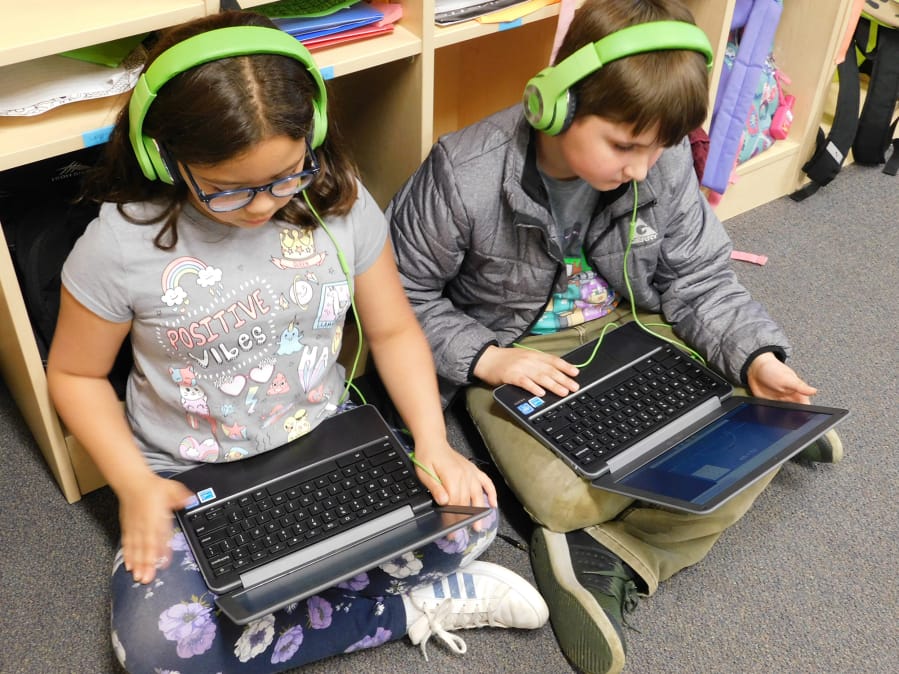 RIDGEFIELD: At South Ridge Elementary School in Ridgefield, students play a math game on laptops during a co-teaching rotation.