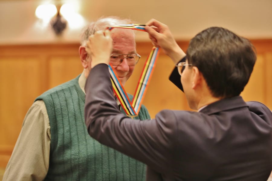 VANCOUVER MALL: Richard Woods of Kelso was presented an Ambassador for Peace Medal by Consul General Lee Hyung-jong, Republic of Korea. Eleven veterans with an Ambassador for Peace Medal at a Nov.