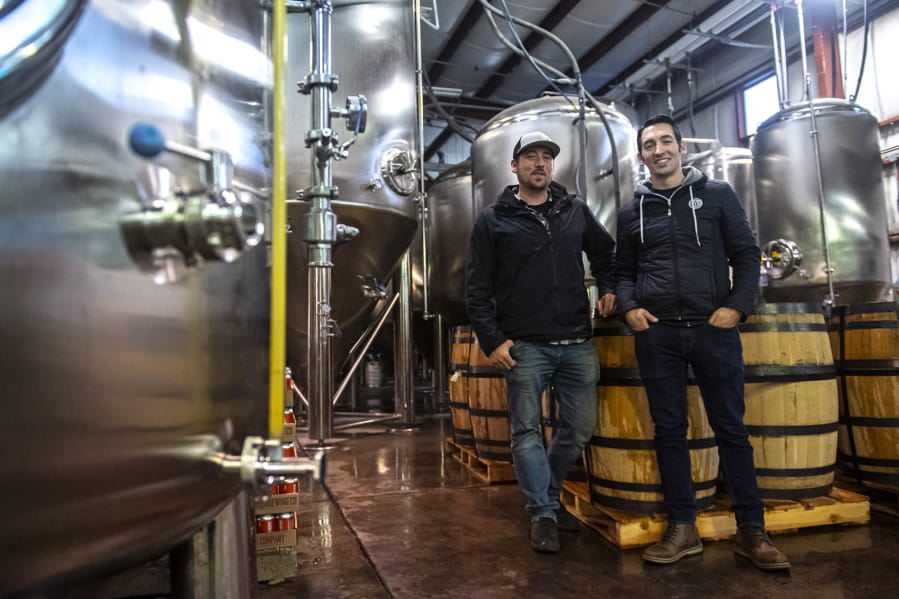 Co-owners of Backwoods Brewing, Tom Waters, left, and Steve Waters stand inside their production facility in Stevenson. The brewery has seen a large amount of growth since it opened in 2012.
