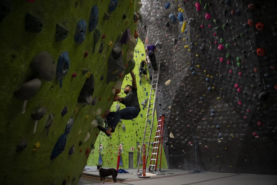 Nathan Ordanza, of Vancouver, boulders at the Source Climbing Center in Vancouver. Ordanza said he likes climbing because it&#039;s a good workout that focuses on problem solving. &quot;With the rainy season here, you can still workout without having to go outside,&quot; he said.