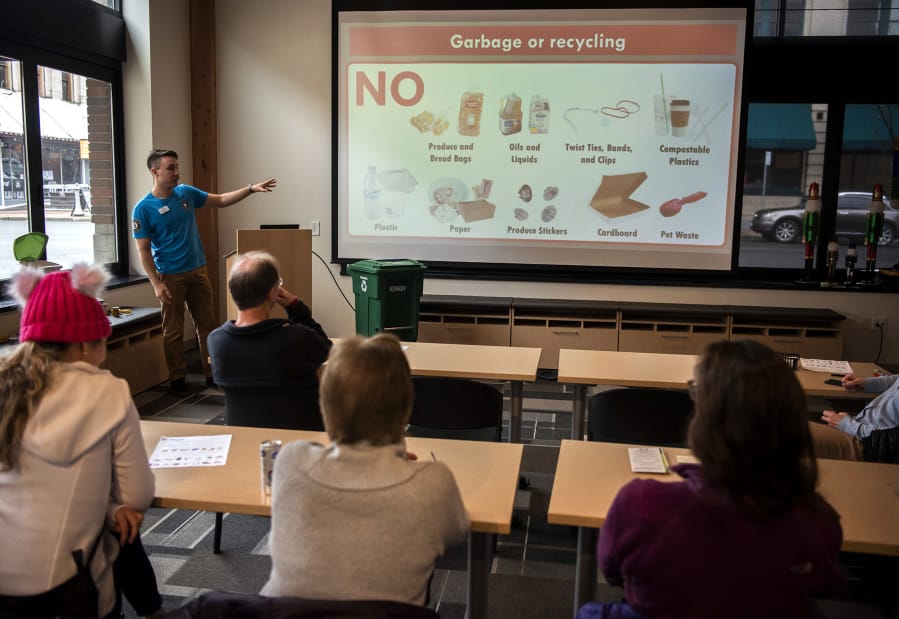 Vancouver Public Works AmeriCorps member Shane Carter discusses items that are not compostable during a lunch-and-learn class offered by Vancouver&#039;s solid waste department at Columbia Bank&#039;s Community Room in Vancouver.