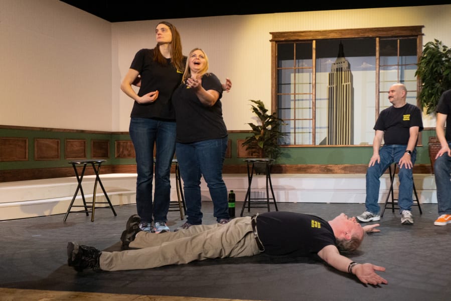 Comedy improvisers Brooke Chamberlain, left, Katie Skinner and Tony Provenzola don&#039;t seem a bit concerned that Martin Slagle is spread-eagled on the floor during a recent show by Magenta Improv Theater.