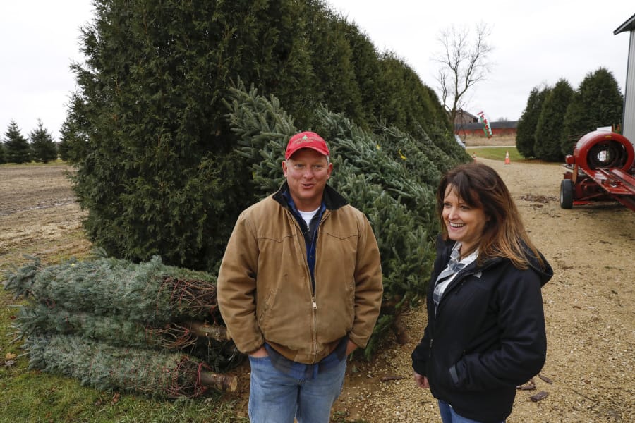 John and Diana Minalt, who own and operate Conifera Tree Farm in Harvard, Ill., discuss their business Nov. 27. The number of Christmas tree farmers is declining across the U.S. as older farmers retire. Illinois dropped from 212 tree growers in 2012 to 182 farmers in 2017, according to the latest U.S. Department of Agriculture data. John Minalt is also a dentist. (Photos by Jose M.