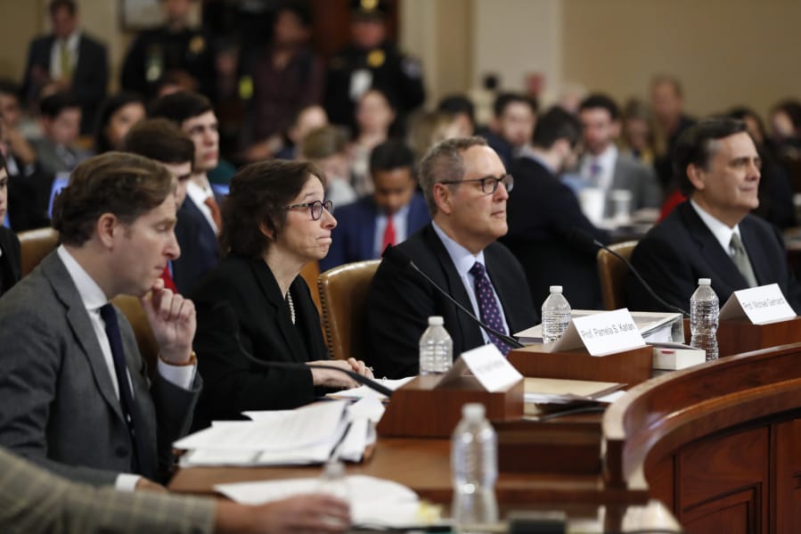 Constitutional law experts, from left, Harvard Law School professor Noah Feldman, Stanford Law School professor Pamela Karlan, University of North Carolina Law School professor Michael Gerhardt and George Washington University Law School professor Jonathan Turley testify Wednesday during a hearing before the House Judiciary Committee on Capitol Hill.