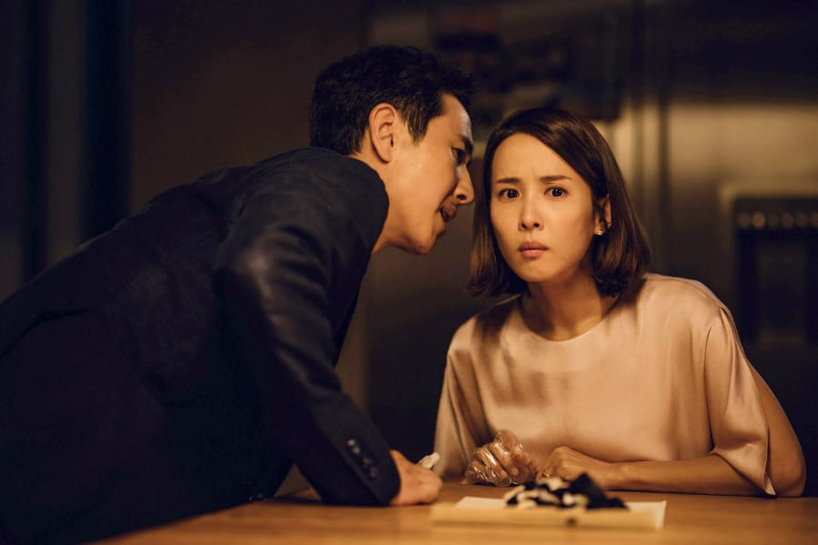 Lee Sun Kyun, left, and Cho Yeo Jeong play the Parks in &quot;Parasite.&quot; (NEON/CJ Entertainment)